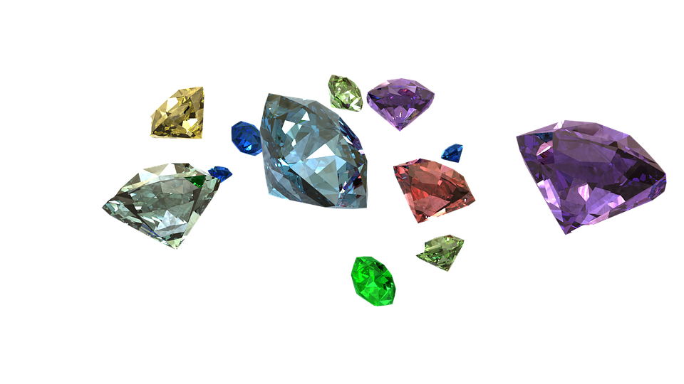 Several loose round cut naturally colored diamonds.