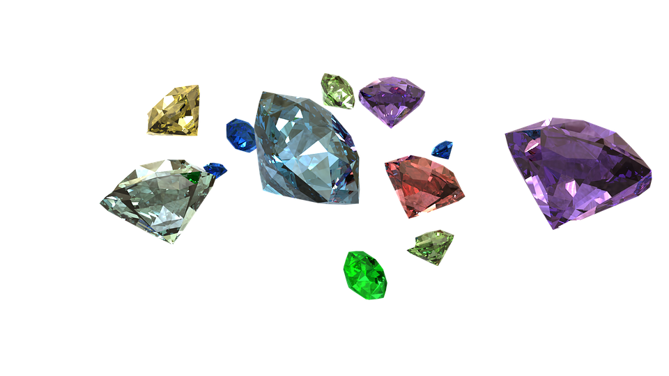 Several loose round cut naturally colored diamonds.