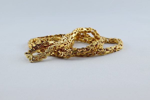 Stack of yellow gold chains.