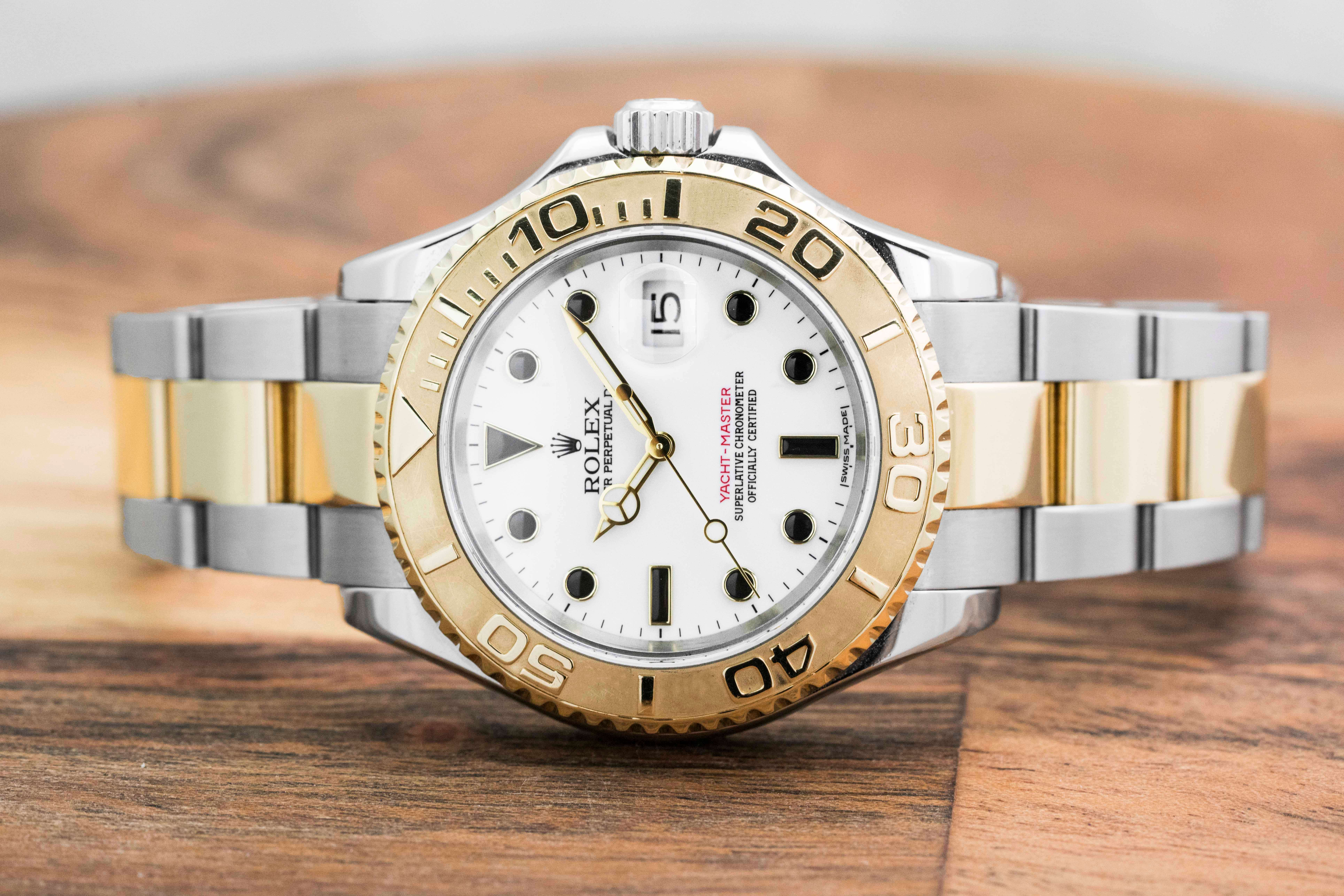 Pre-owned men’s Rolex Yacht-Master in stainless steel and yellow gold with a white dial.