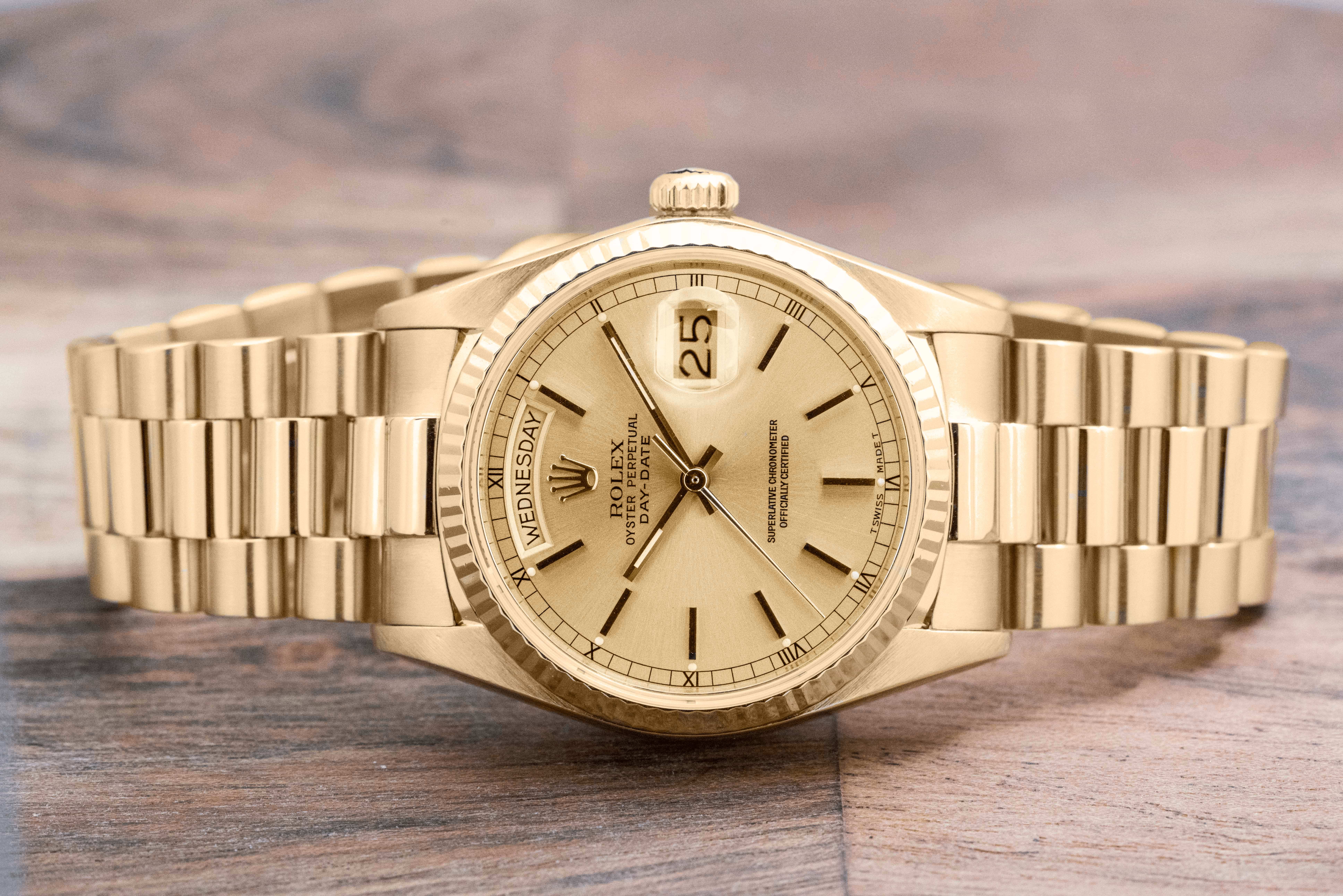 Pre-owned men’s Rolex Day-Date in yellow gold with gold dial.