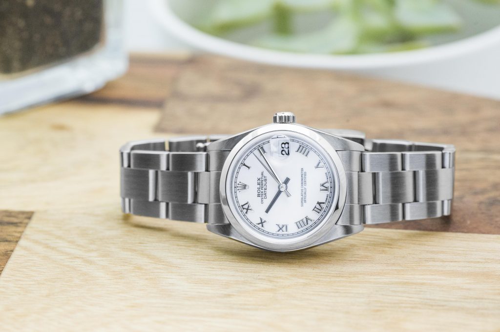 Pre-owned women’s Rolex Datejust in stainless steel with white dial.