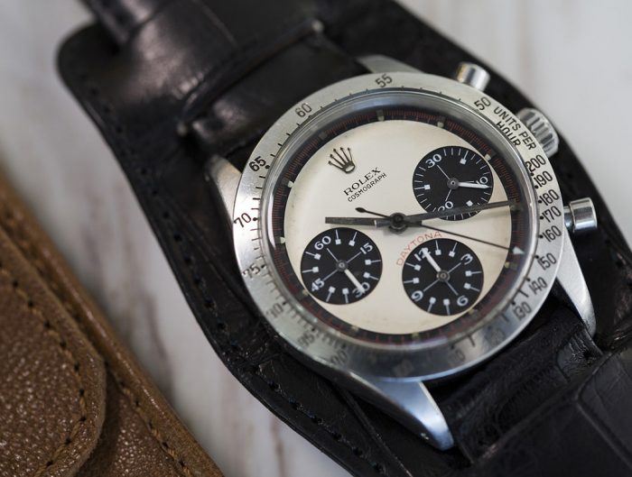 Pre-owned men's Rolex with a whtie dal and black leather strap.