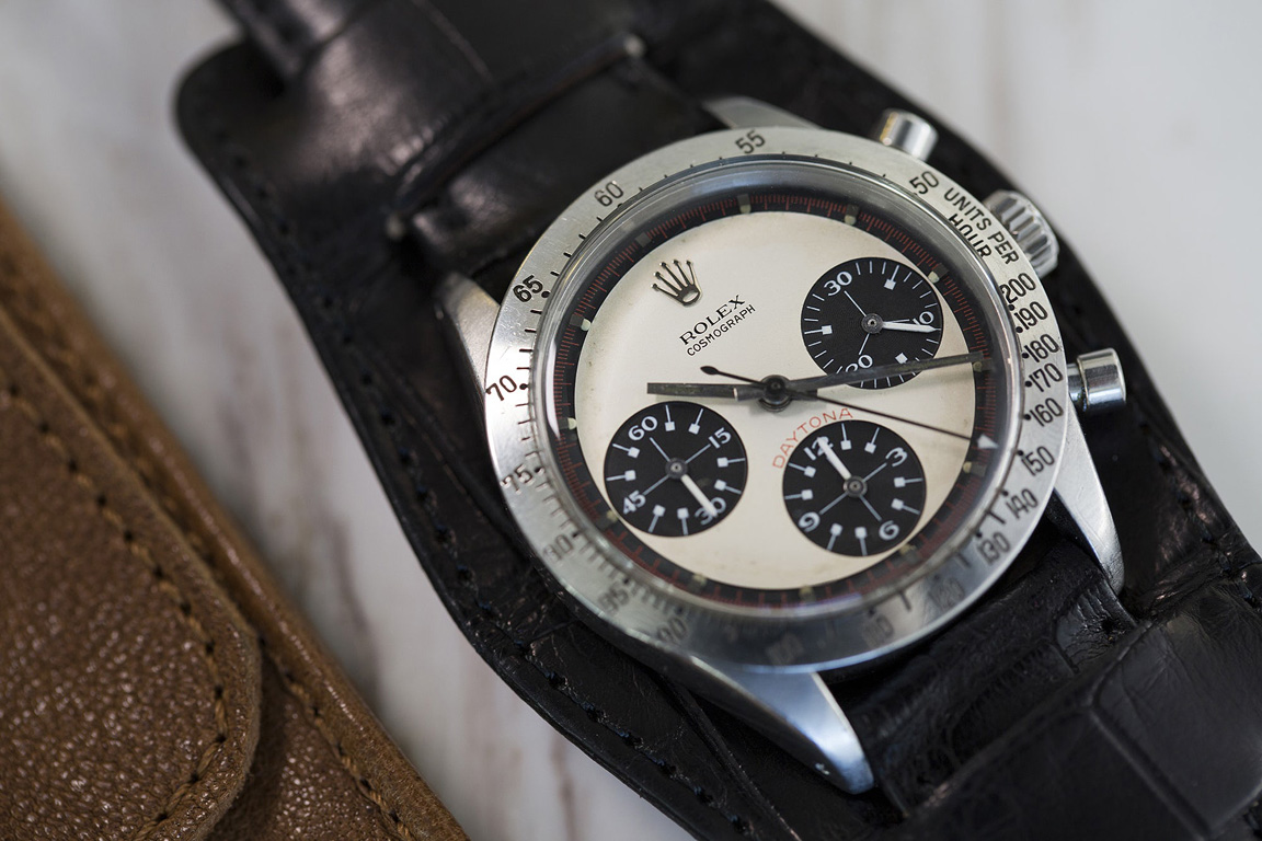 Pre-owned men's Rolex with a whtie dal and black leather strap.