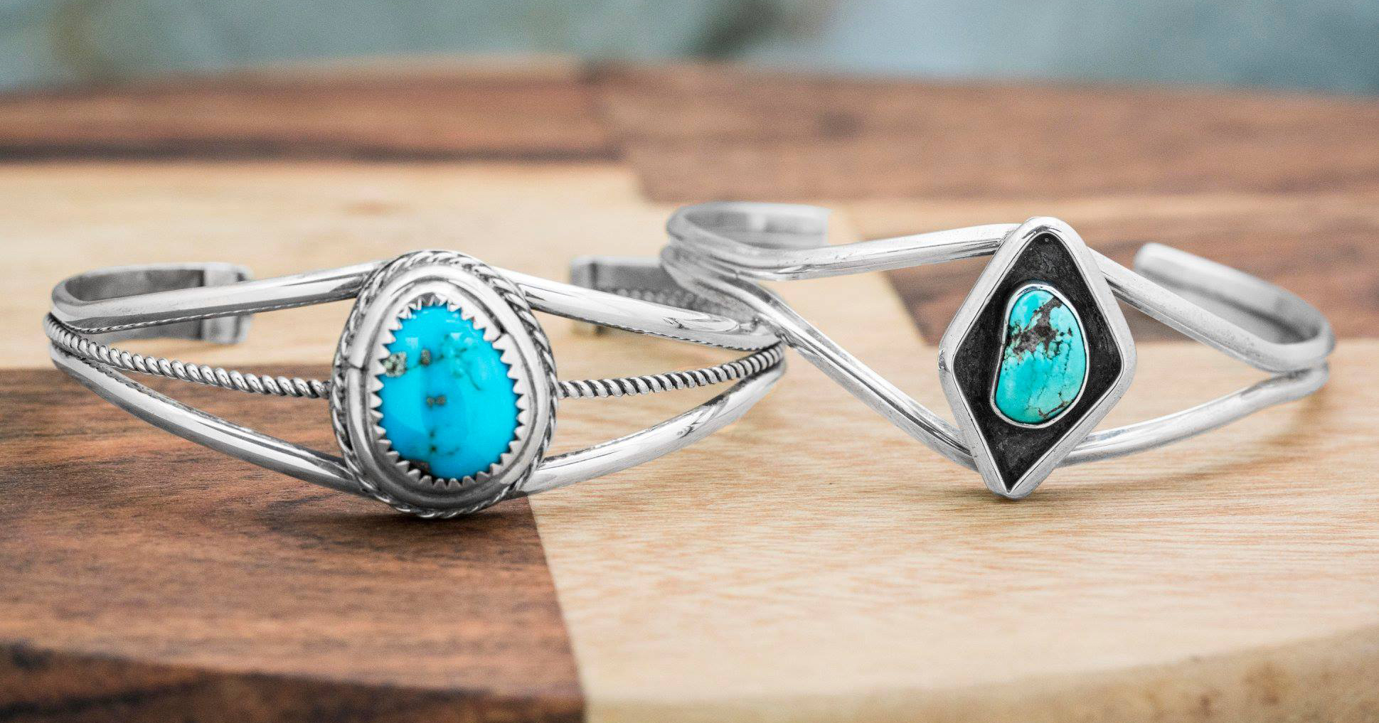 Two sterling silver split shank rings centered with turquoise.