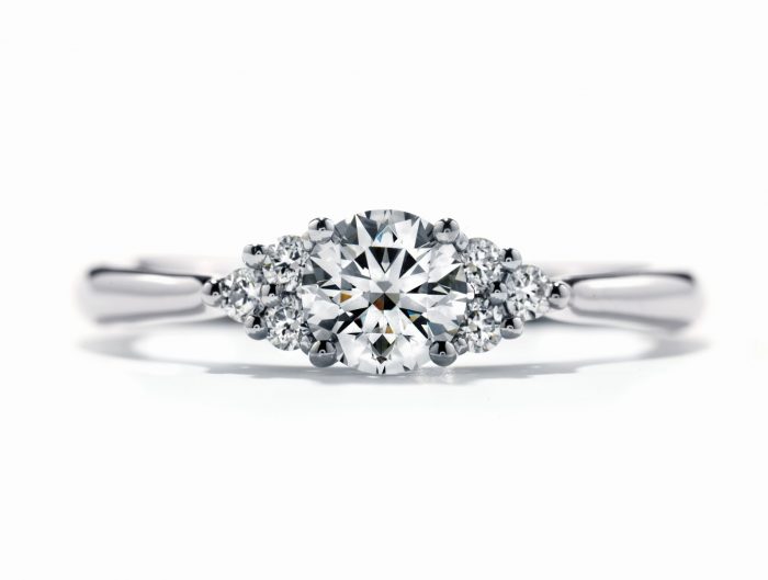 Rose gold diamond engagement ring with diamond halo.