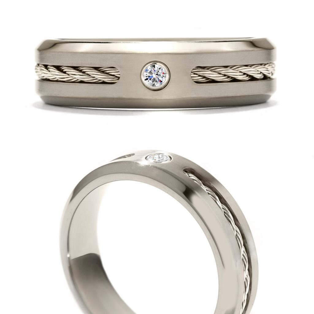 White gold men’s cable wedding band with a diamond center.