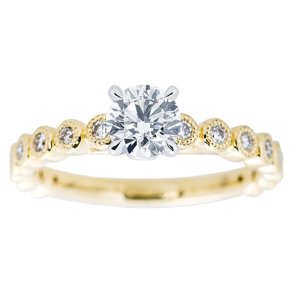 Yellow gold diamond engagement ring with diamonds in the band.