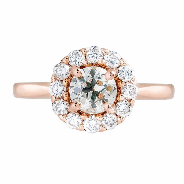 Rose gold diamond engagement ring with diamond halo.