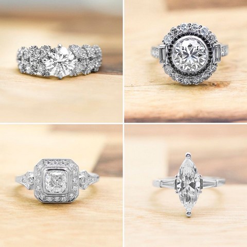 White gold diamond engagement rings with diamond haloes and diamonds in the bands
on wooden table.