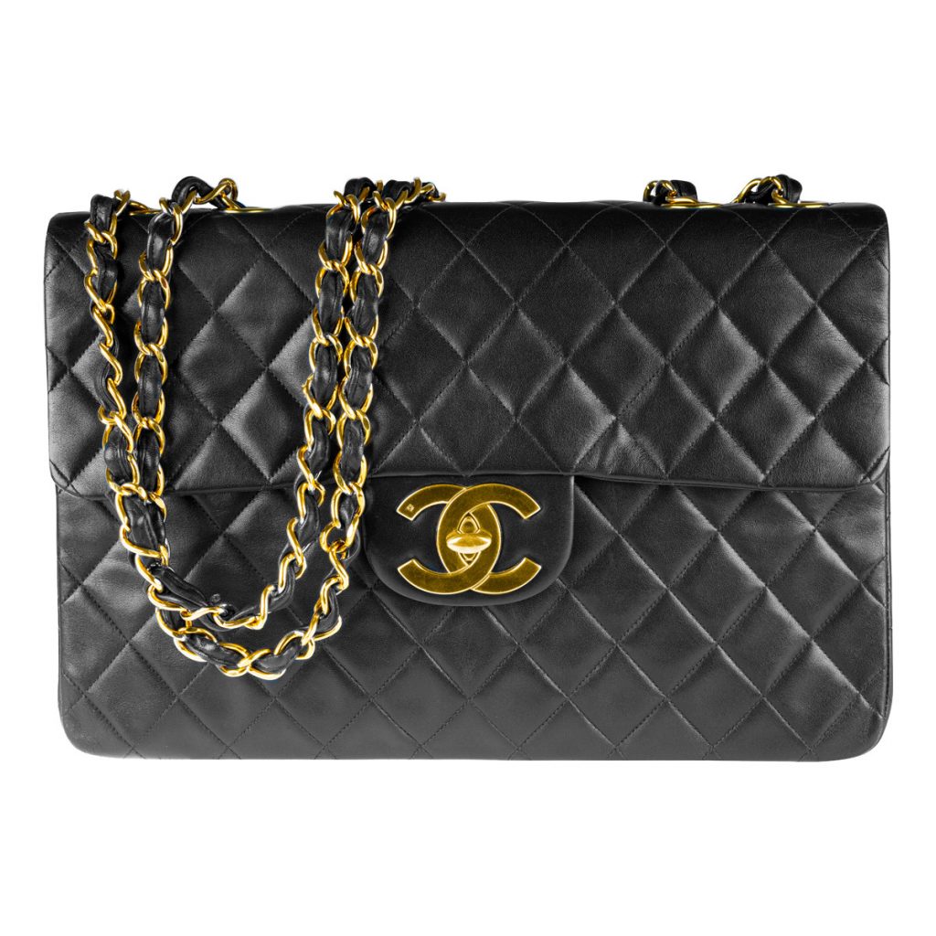 Vintage lambskin Chanel Maxi Classic Flap shoulder bag in black with gold hardware.
