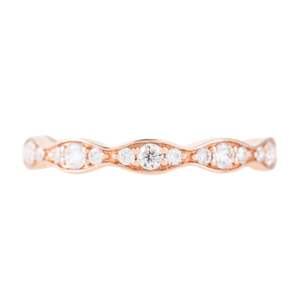 Rose gold scalloped stacking wedding band set with diamonds.