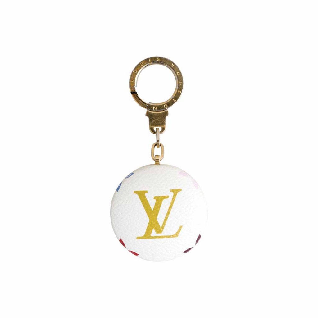 Vintage white and gold Louis Vuitton logo keychain.
