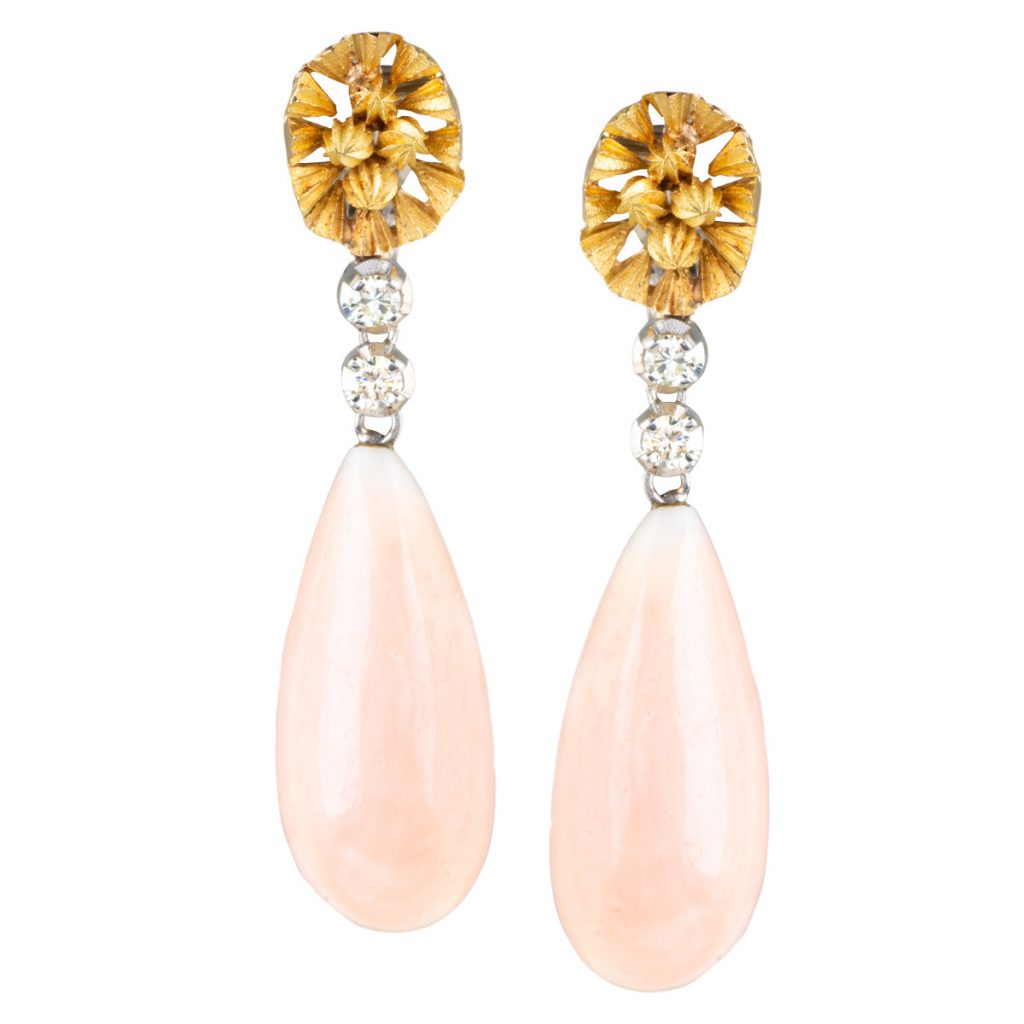 White and yellow gold tear drop earrings set with coral and diamonds.