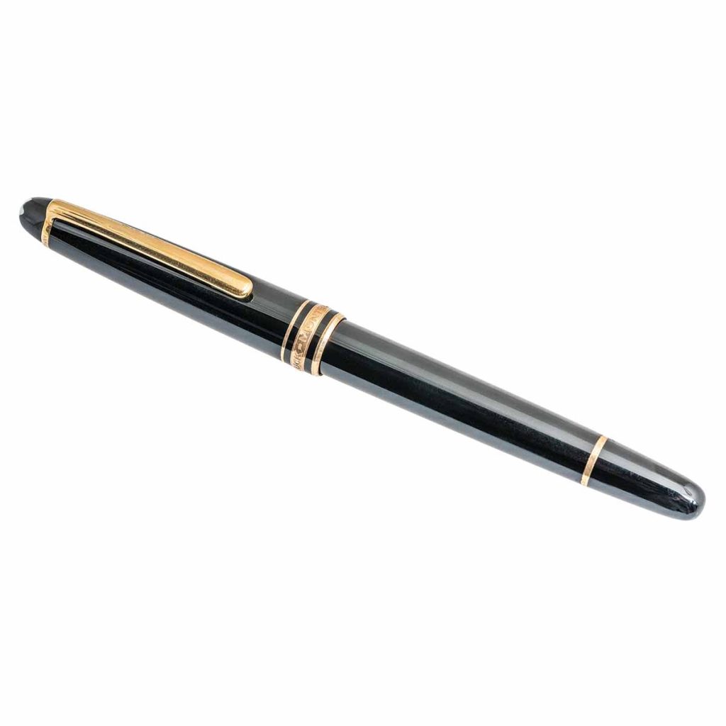 Vintage Mont Blanc Meisterstuck Classique fountain pen in gold and black with a yellow
gold nib.