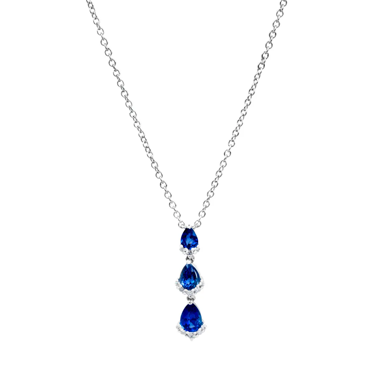 White gold three-station drop necklace set with diamonds and sapphires.