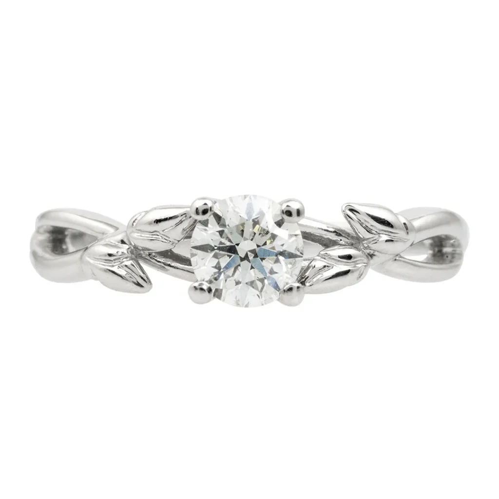 White gold solitaire diamond floral engagement ring.