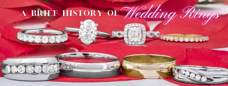 Various wedding and engagement rings on a red petal background with text “A Brief History of Wedding Rings”.