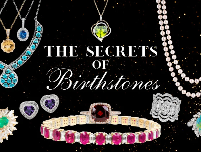 Various birthstone jewelry pieces on a black and gold speckled background with text “The Secrets of Birthstones”.