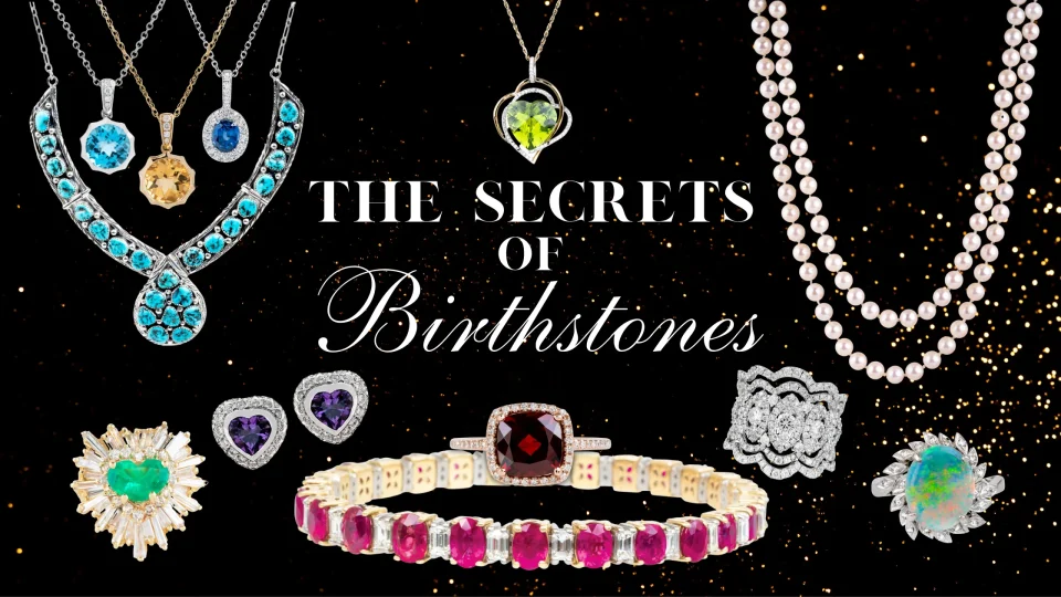 Various birthstone jewelry pieces on a black and gold speckled background with text “The Secrets of Birthstones”.