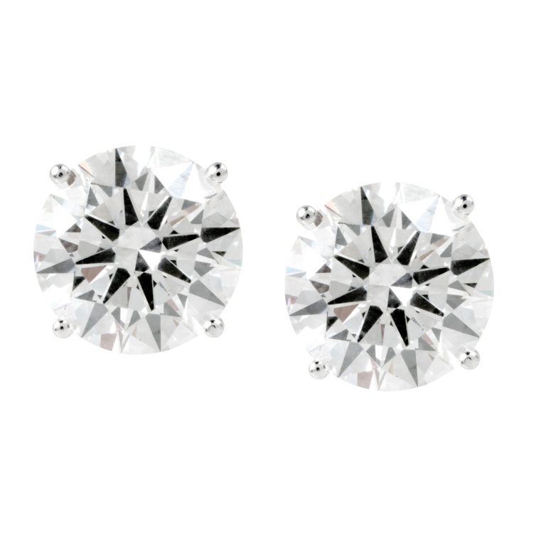 Men’s white gold diamond stud earrings.