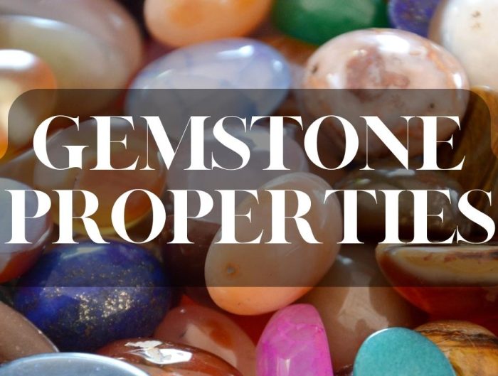 Pile of rough gemstones background with text “Gemstone Properties”.