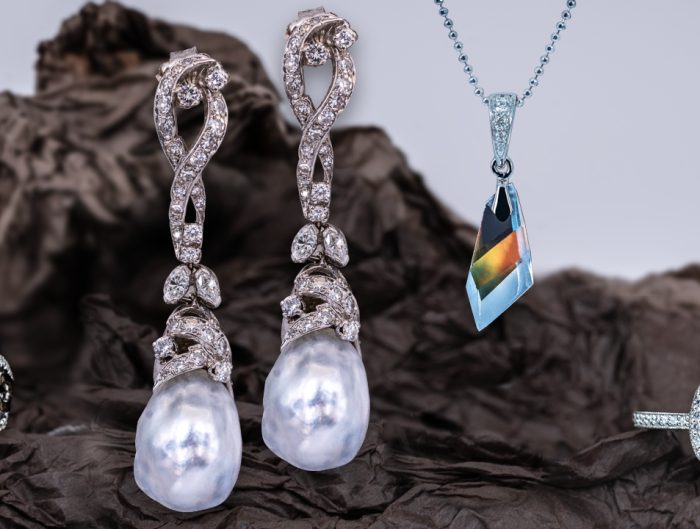 Moonstone and diamond ring, pearl and diamond drop earrings, moonstone and diamond pendant, and alexandrite and diamond ring.