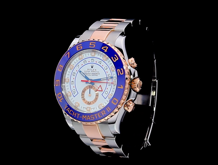 Pre-owned men's Rolex Yacht-Master II in stainless steel and yellow gold with a white dial and blue ceramic bezel.