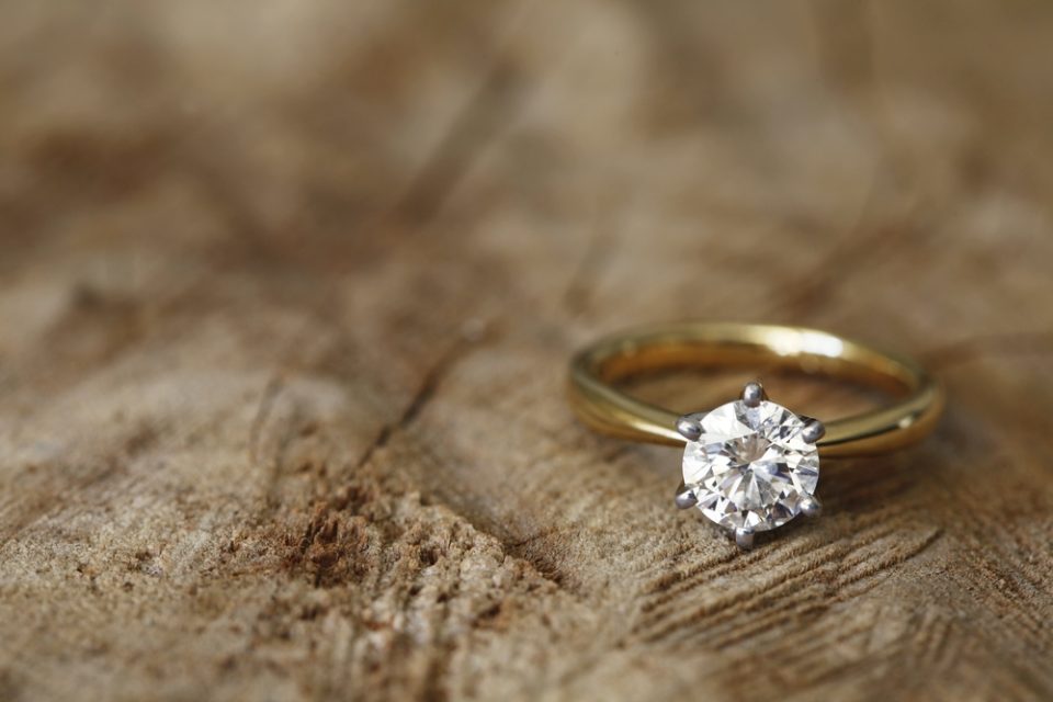 Yellow gold solitaire diamond engagement ring.