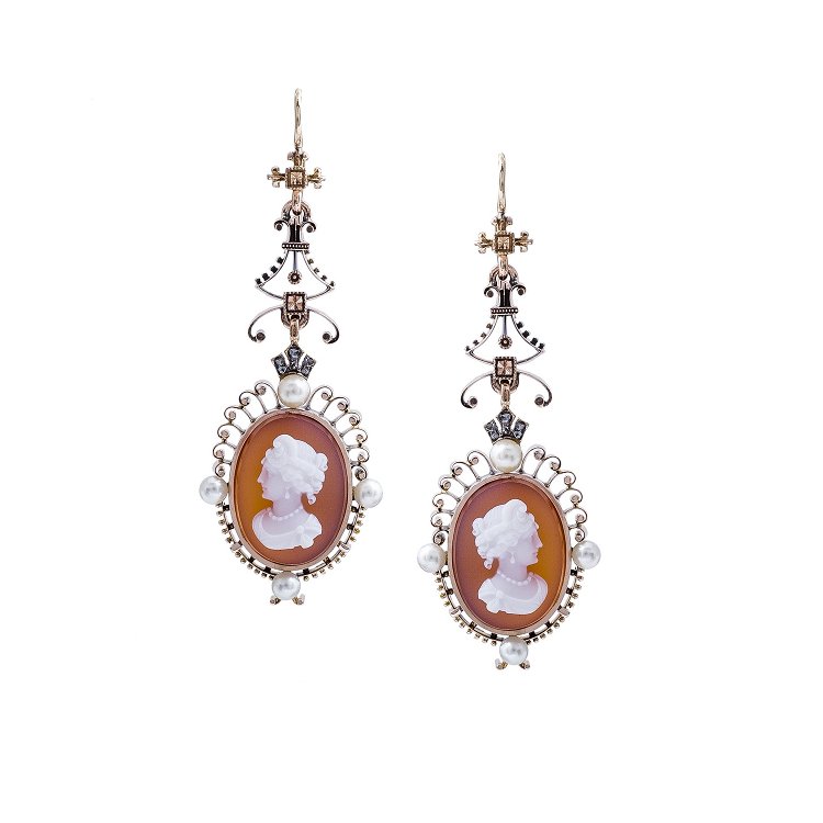 Antique cameo dangle earrings set with pearls.