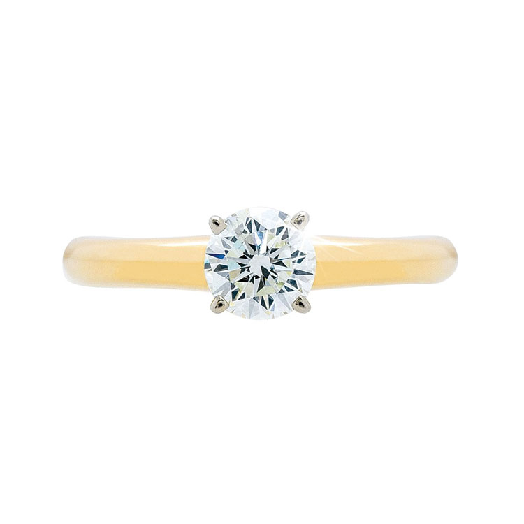 Yellow gold solitaire round diamond engagement ring.