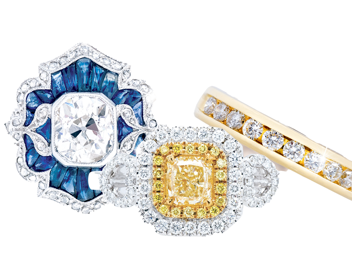 Three diamond and gemstone wedding and engagement rings.