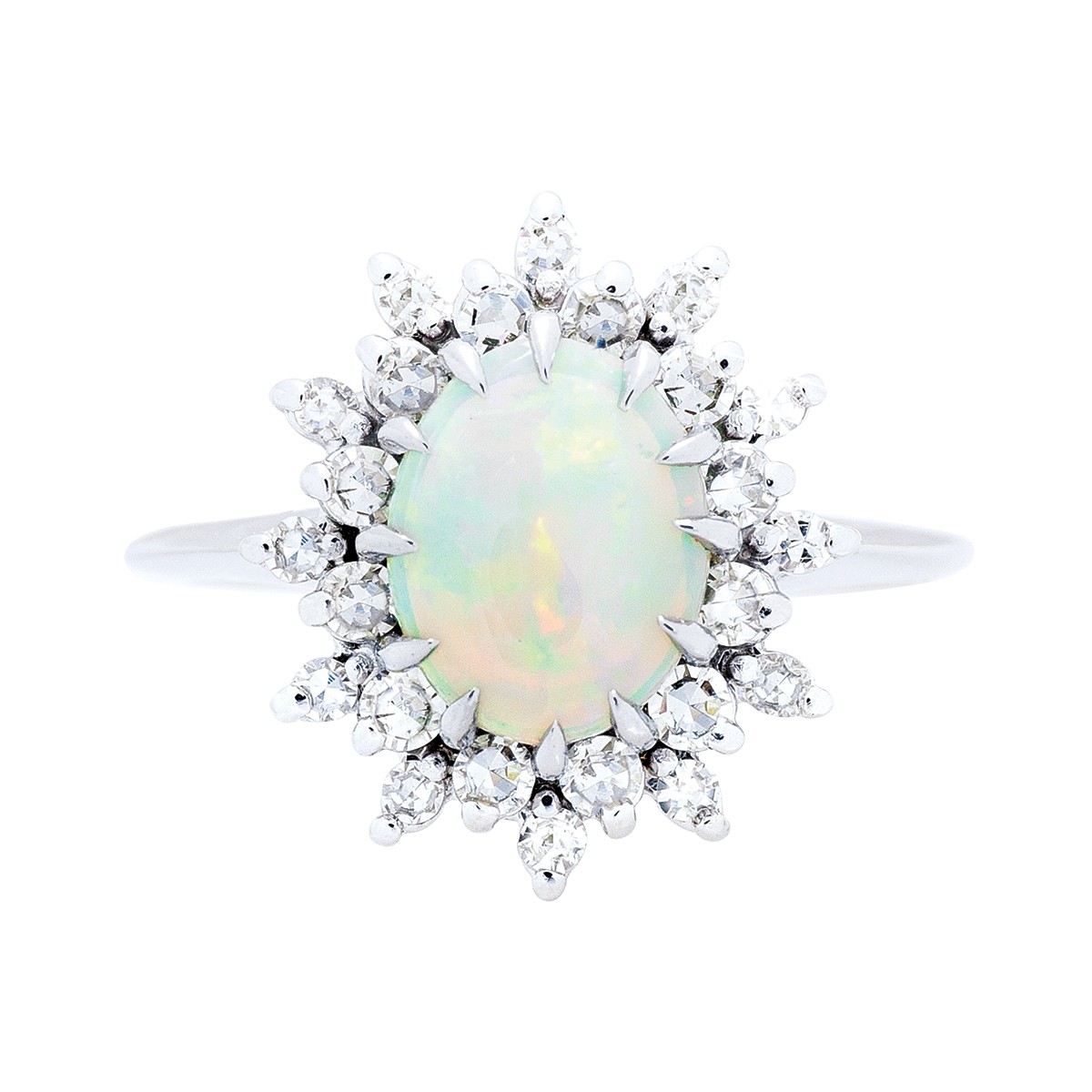 White gold ring centered with an opal surrounded by a halo of diamonds.