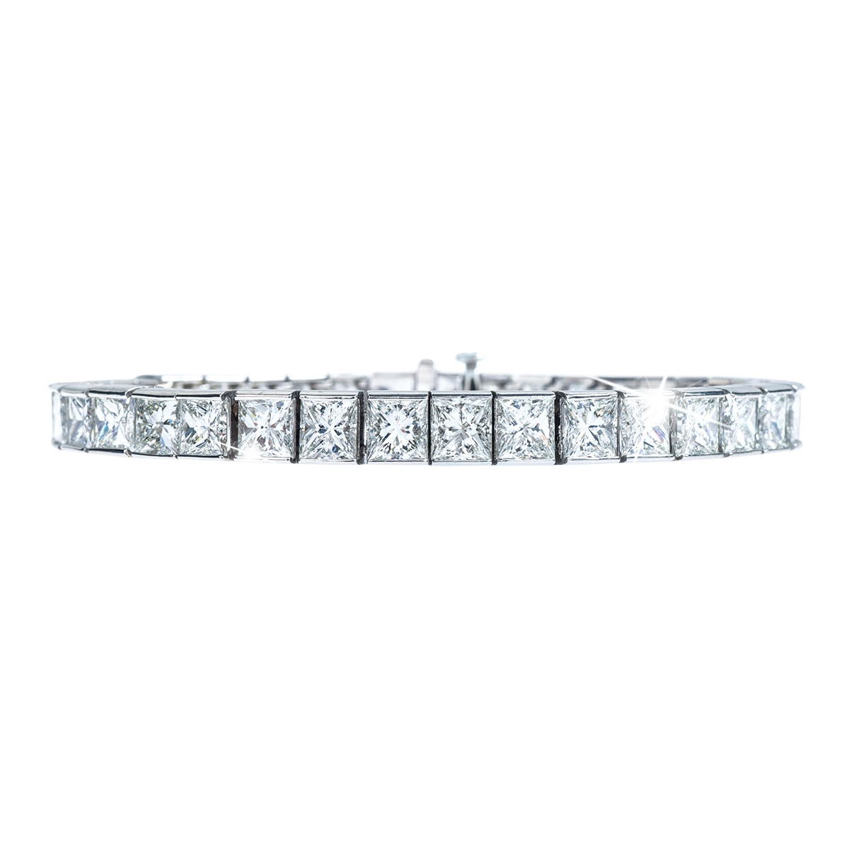Platinum tennis bracelet set with princess cut diamonds.