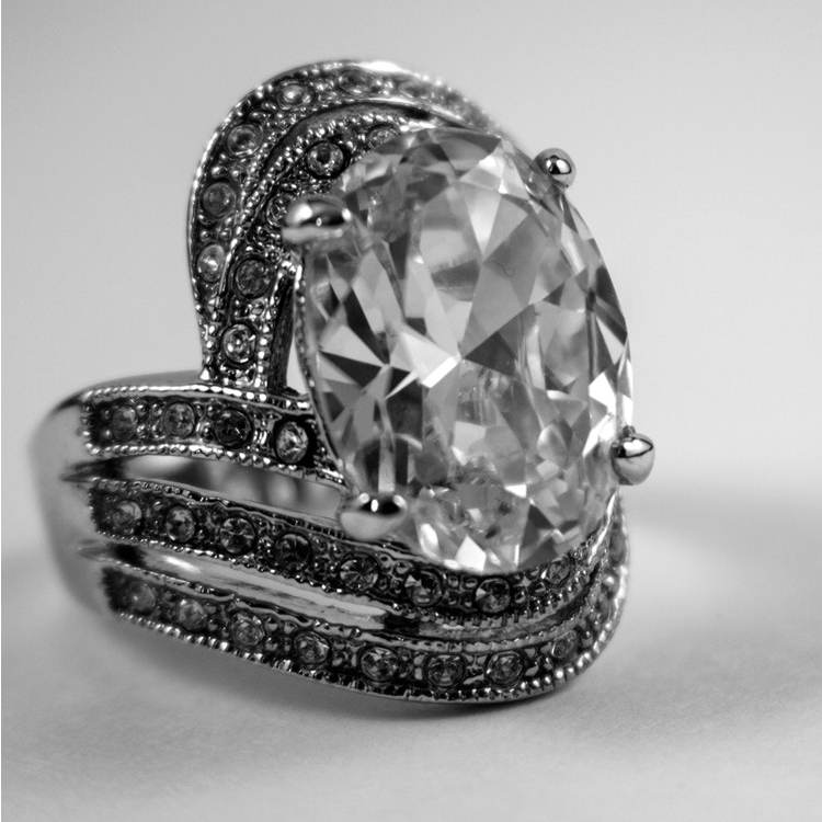 Platinum engagement ring centered with a diamond and diamonds in the band.