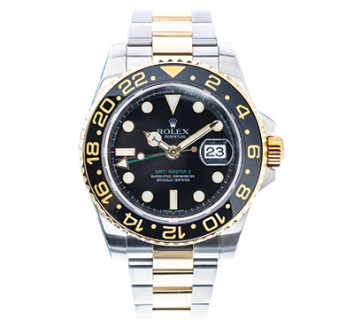 Pre-owned Rolex Submariner in stainless steel and yellow gold with a black dial.