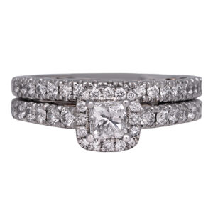 white gold halo engagement ring and wedding band set with a princess diamond and diamonds in the band