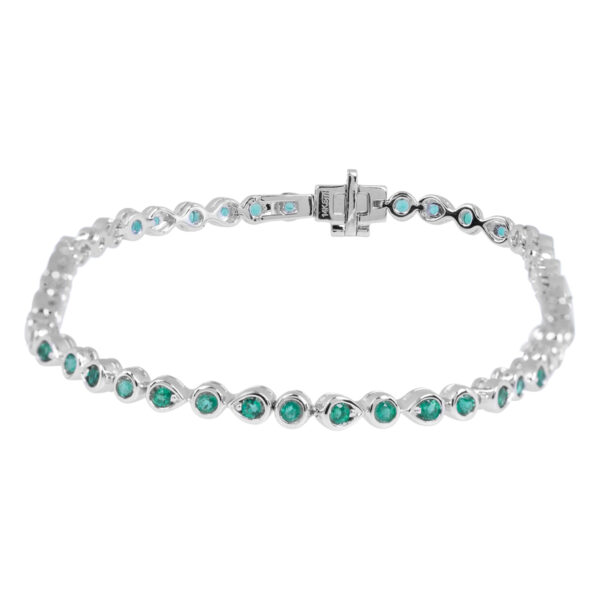 white gold tennis bracelet set with round emeralds