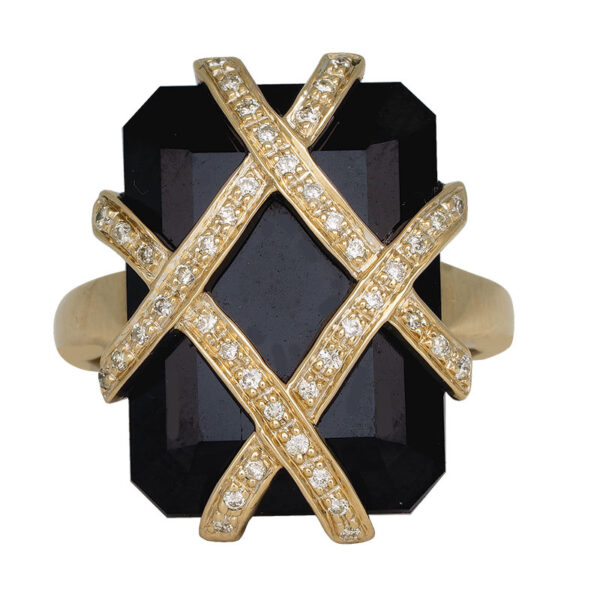 yellow gold ring set with a large emerald cut onyx with paved diamond bands overlapping the stone