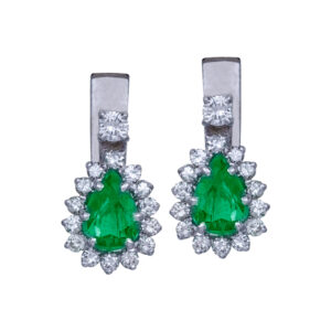 white gold earrings set with pear shaped emeralds and small diamond haloes