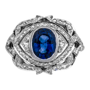 Vintage 18k white gold milgrain ring set with a 1.00 carat oval sapphire plus 0.55 carats of round brilliant earth-mined diamonds.