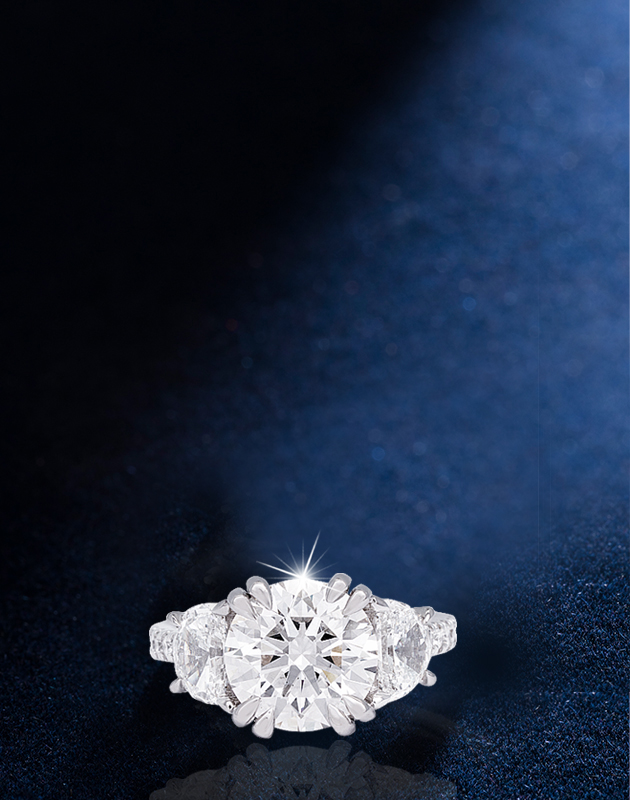 diamond white gold ring on a backlit dark blue background