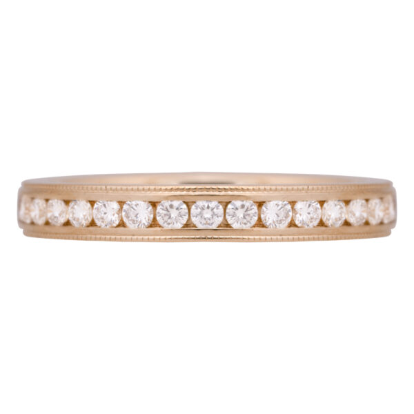 yellow gold anniversary band set with channel set white diamonds