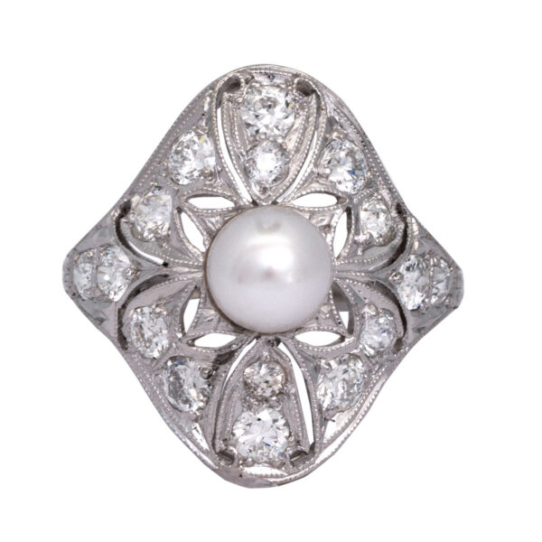 white gold antique elongated ring with a center pearl surrounded by old European cut diamonds and milgrain texture