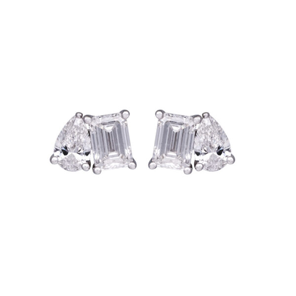 white gold toi et moi stud earrings set with pear and emerald cut diamonds