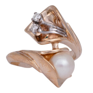 yellow gold bypass ring set with small diamonds and an akoya pearl