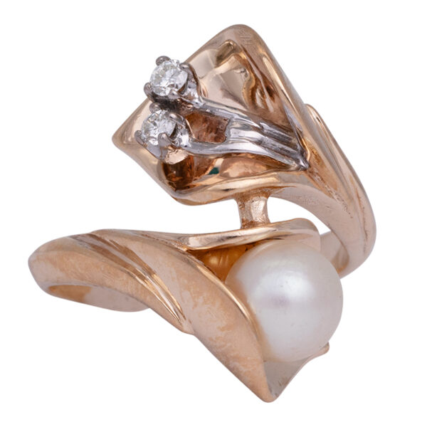 yellow gold bypass ring set with small diamonds and an akoya pearl