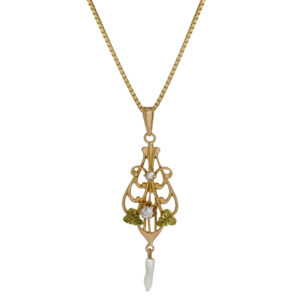 10k yellow gold art nouveau style pendant set with a small diamond & seed pearl dangle
