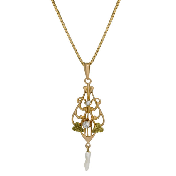 10k yellow gold art nouveau style pendant set with a small diamond & seed pearl dangle