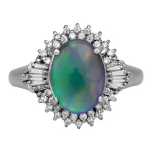 white gold ring centered with an oval black opal surrounded by a round & baguette diamond halo